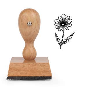 Fine-Line Daisy Stem Craft Stamp standing upright beside its black stamped fine-line daisy stem image