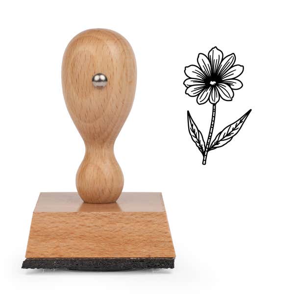 Fine-Line Daisy Stem Craft Stamp standing upright beside its black stamped fine-line daisy stem image