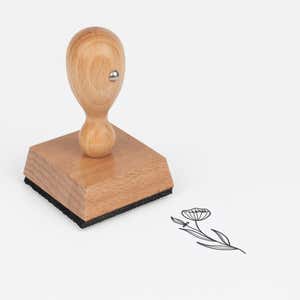 Veined Cup Wildflower Craft Stamp at an angle with its wooden handle and block