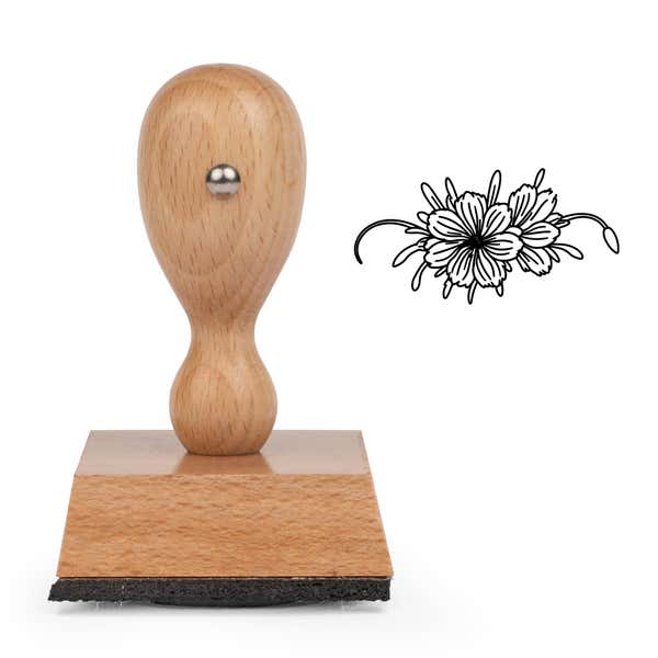 Wide Floral Spray Craft Stamp standing upright beside its black stamped wide floral spray image