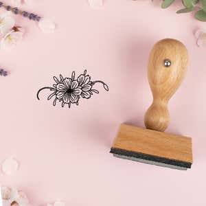 Wide floral spray stamped in black on pink cardstock with lavender sprigs and blossoms