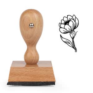 Layered Petal Bloom Craft Stamp standing upright beside its black stamped layered petal bloom image