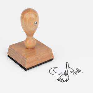 Enchanted Witch Broom Craft Stamp at an angle with its wooden handle and block