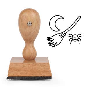 Enchanted Witch Broom Craft Stamp standing upright beside its black stamped witch broom image
