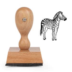 Safari Zebra Craft Stamp standing upright beside its black stamped striped zebra image