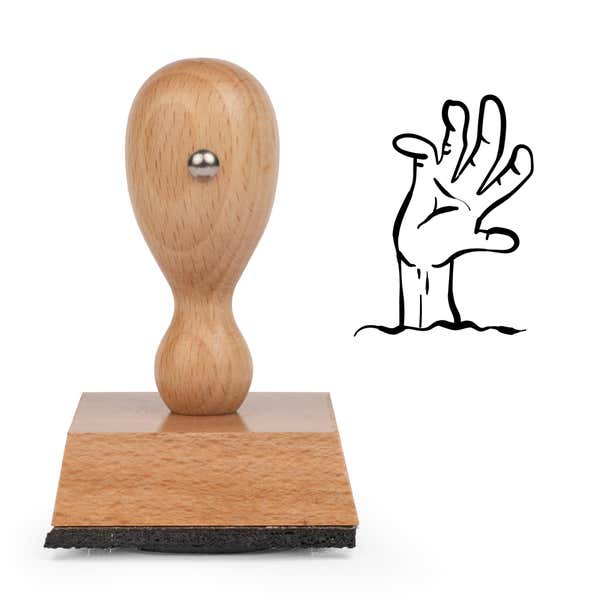 Undead Zombie Hand Craft Stamp standing upright beside its black stamped zombie hand image