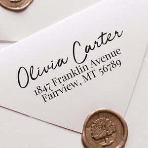 Relaxed Script Custom Address Stamp impression close up on white envelope