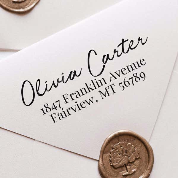 Relaxed Script Custom Address Stamp impression close up on white envelope