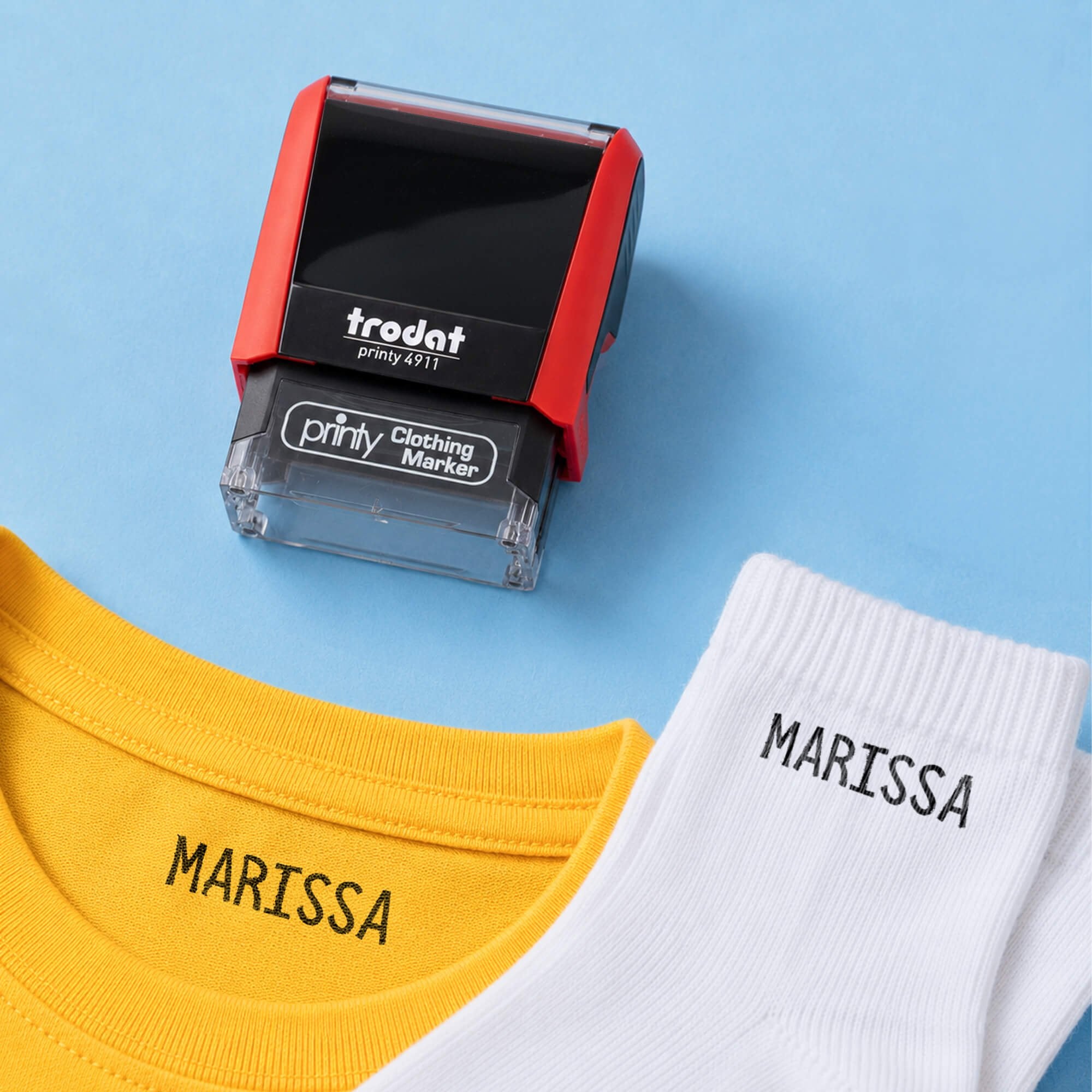 Example of the Trodat 4911 Clothing Name Stamp on socks and a shirt