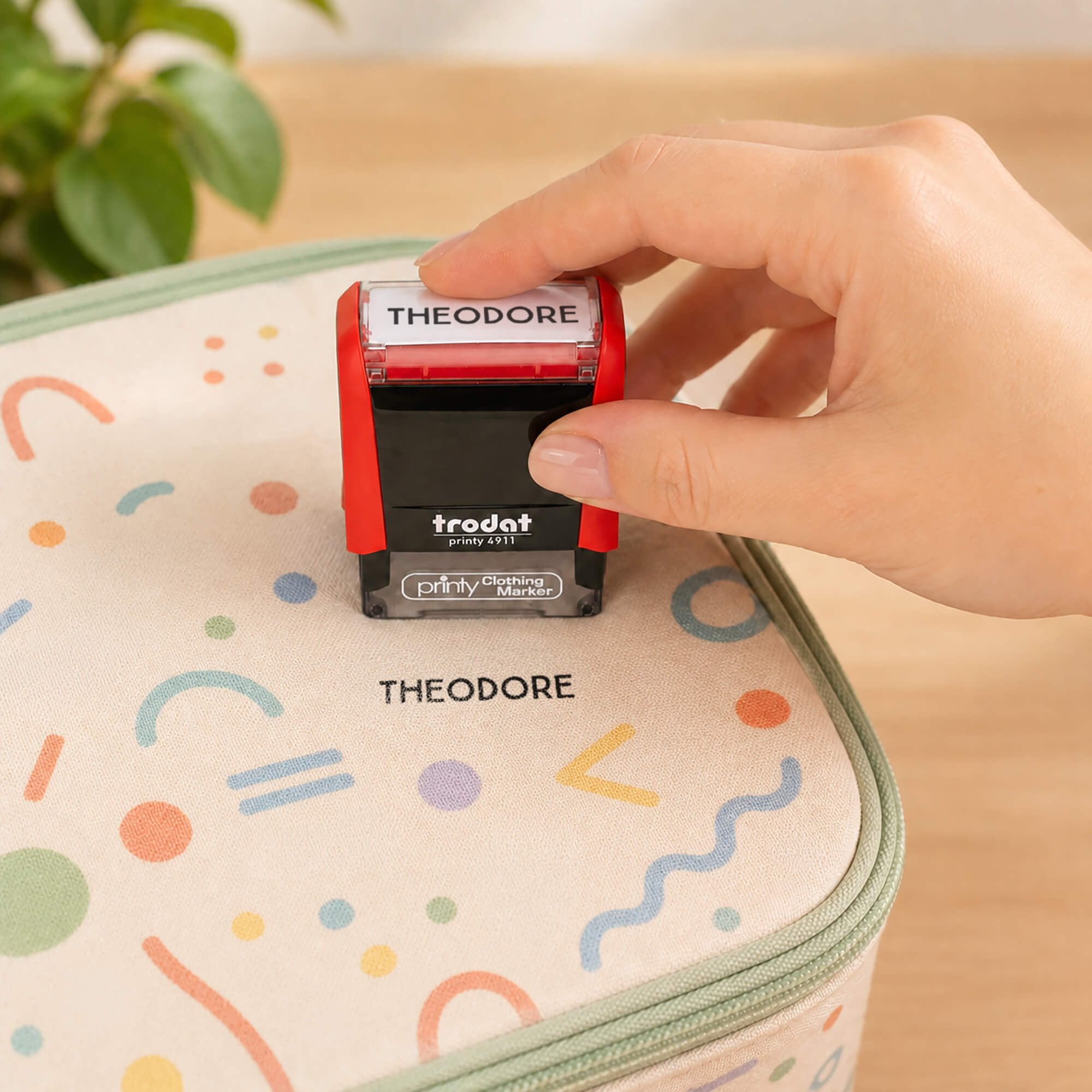 Rustic Clothing Stamp impression onto a lunchbox