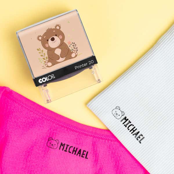 Bear clothing name stamp beside pink and light gray shirts labeled Michael