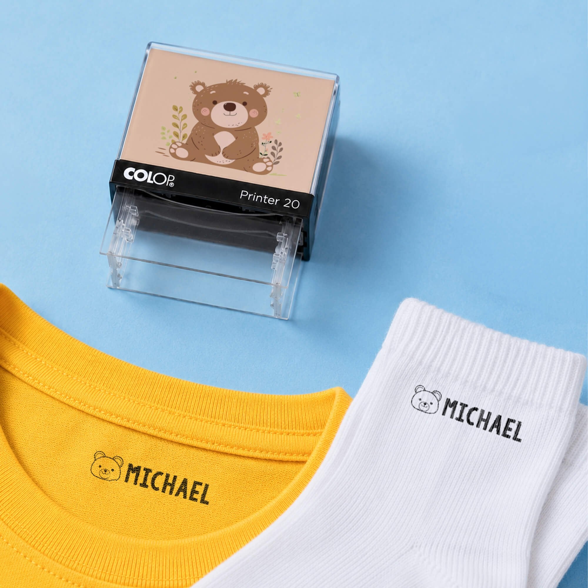 Bear clothing name stamp with a yellow shirt and white socks labeled Michael