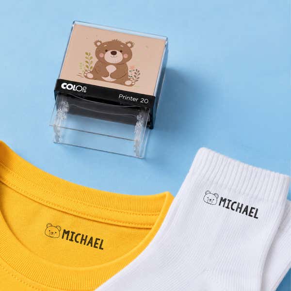 Bear clothing name stamp with a yellow shirt and white socks labeled Michael