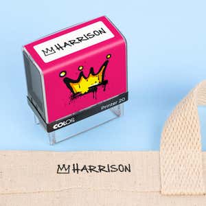 Crown clothing name stamp beside a canvas tote bag labeled Harrison