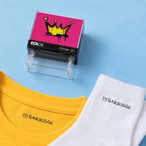 Crown clothing name stamp with a yellow shirt and white socks labeled Harrison
