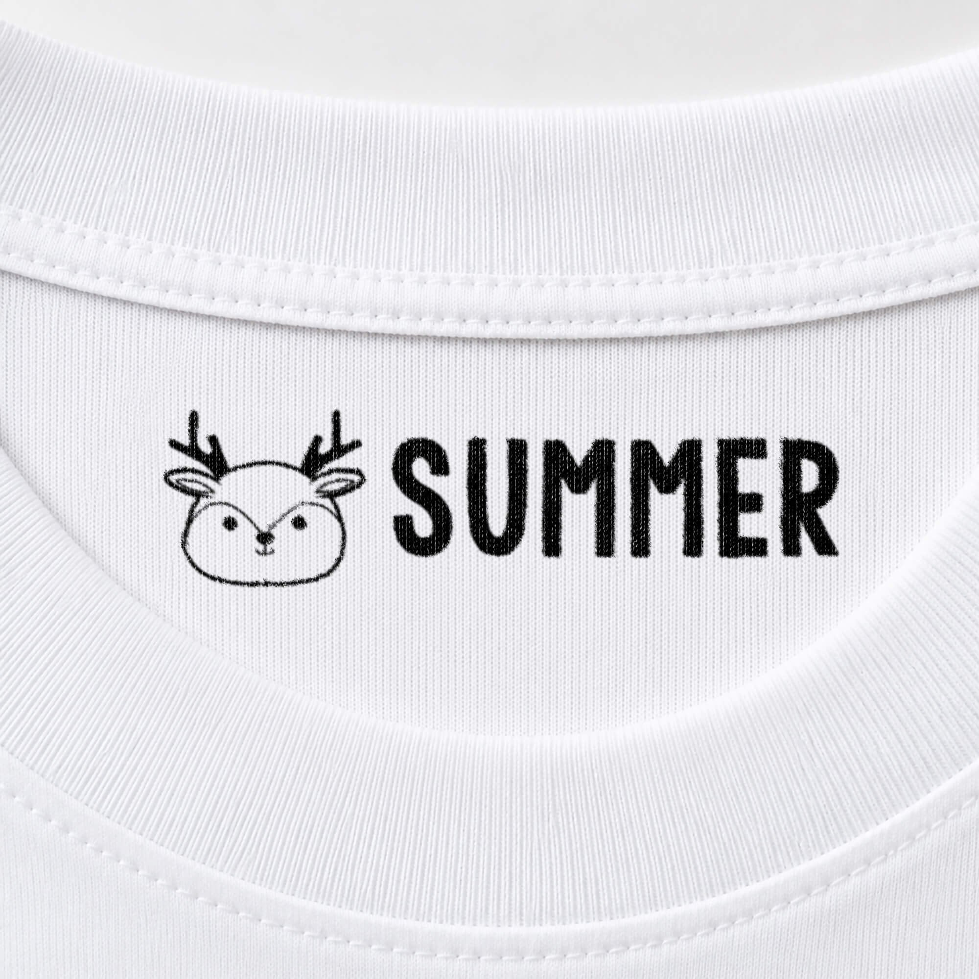 Deer name stamp reading Summer inside the collar of a white shirt