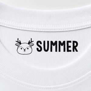 Deer name stamp reading Summer inside the collar of a white shirt