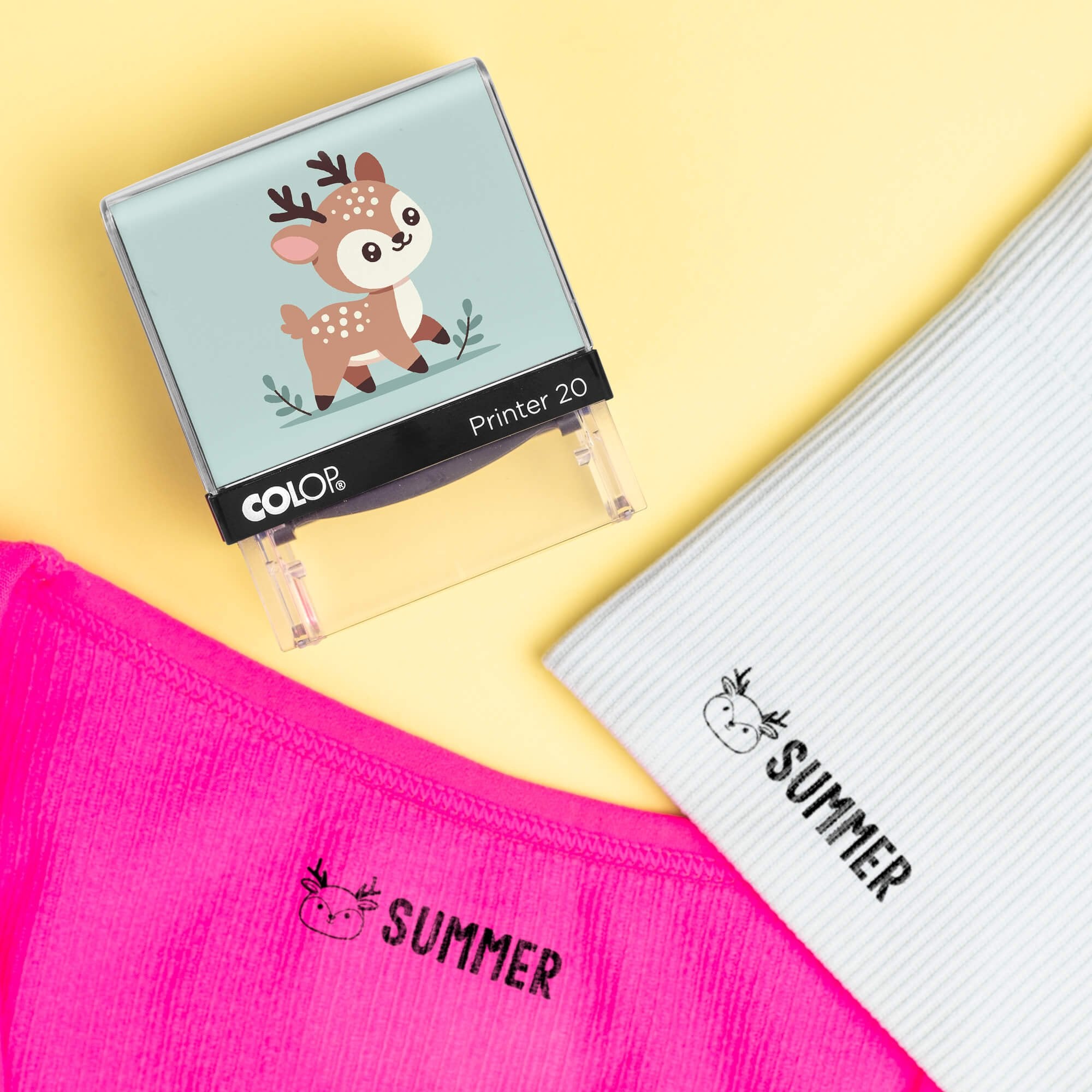 Deer clothing name stamp beside pink and light gray shirts labeled Summer