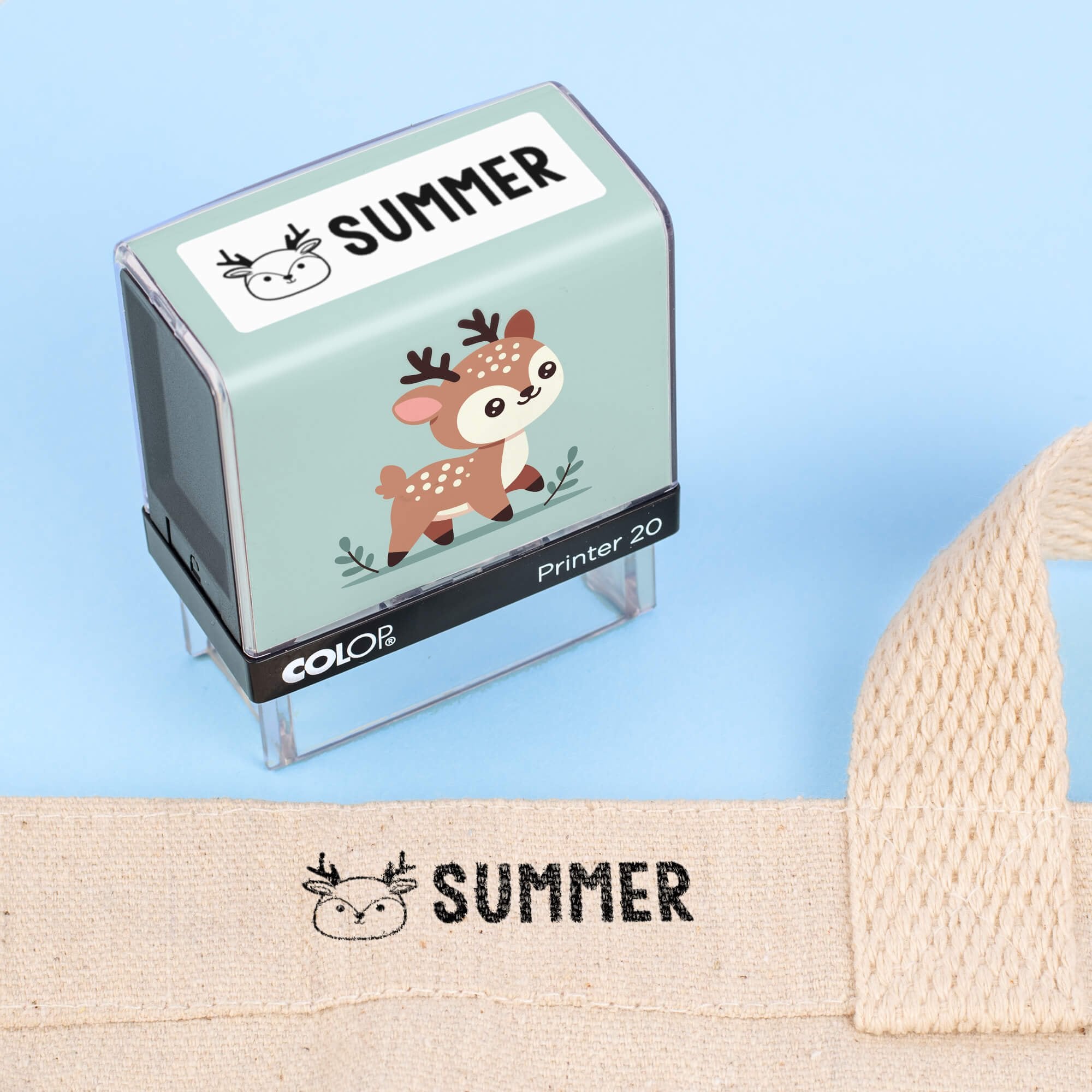 Deer clothing name stamp beside a canvas tote bag labeled Summer