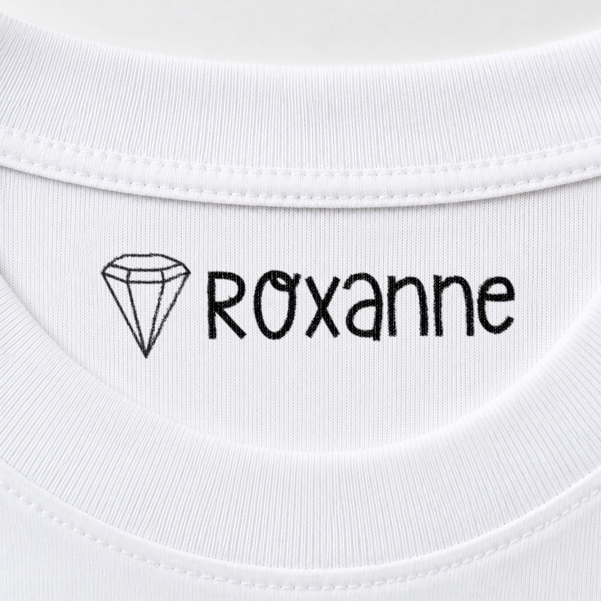 Diamond name stamp reading Roxanne inside the collar of a white shirt
