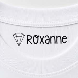 Diamond name stamp reading Roxanne inside the collar of a white shirt