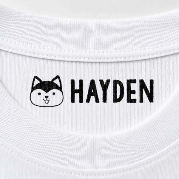 Dog name stamp reading Hayden inside the collar of a white shirt