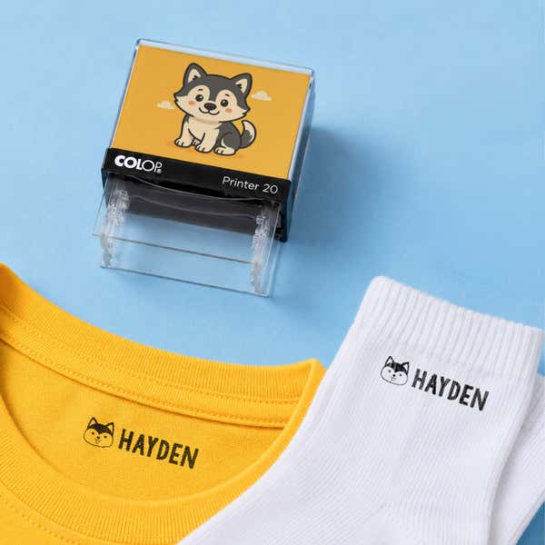Dog clothing name stamp with a yellow shirt and white socks labeled Hayden