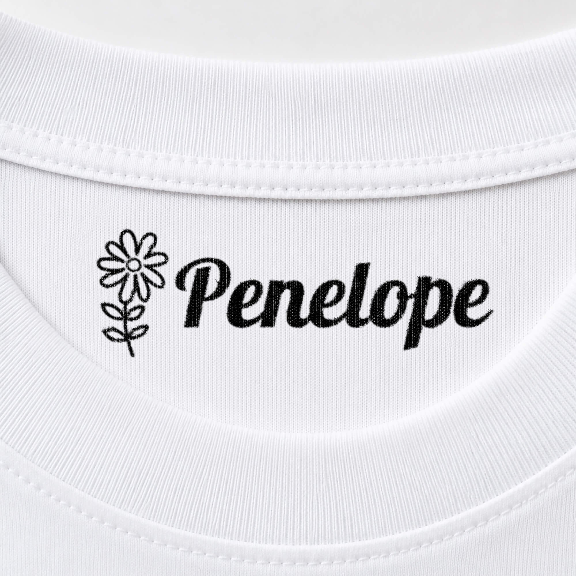 Flower name stamp reading Penelope inside the collar of a white shirt