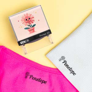Flower clothing name stamp beside pink and light gray shirts labeled Penelope