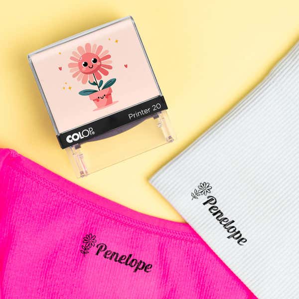 Flower clothing name stamp beside pink and light gray shirts labeled Penelope