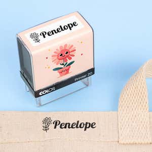 Flower clothing name stamp beside a canvas tote bag labeled Penelope