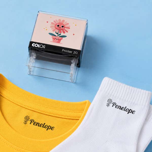 Flower clothing name stamp with a yellow shirt and white socks labeled Penelope