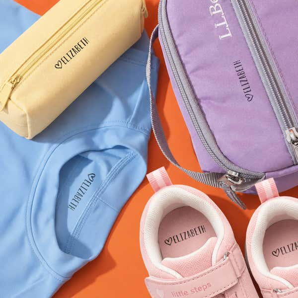 Heart name stamp impressions on a pencil case, lunch bag, shirt and pink shoes