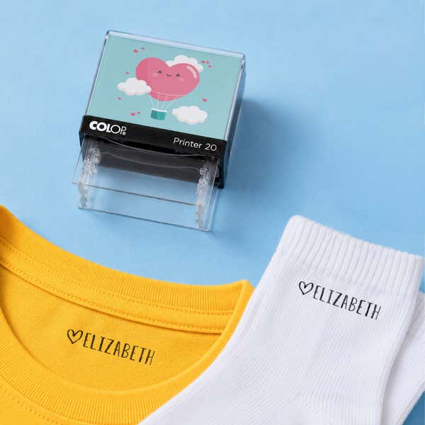 Heart clothing name stamp with a yellow shirt and white socks labeled Elizabeth