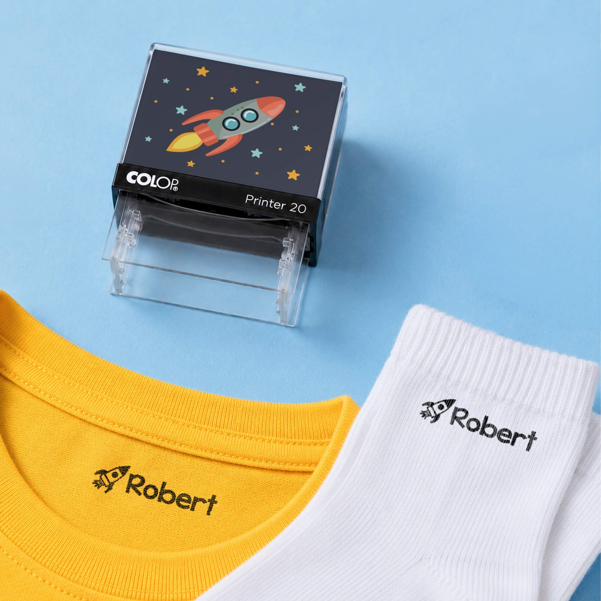 Rocket clothing name stamp with a yellow shirt and white socks labeled Robert