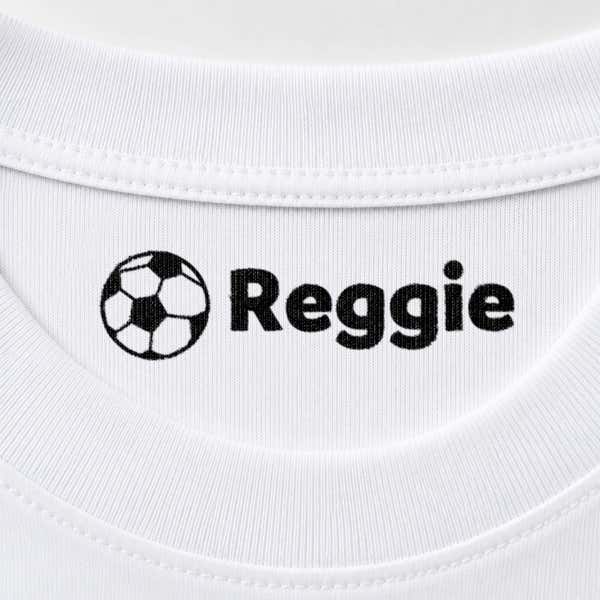 Soccer name stamp reading Reggie inside the collar of a white shirt
