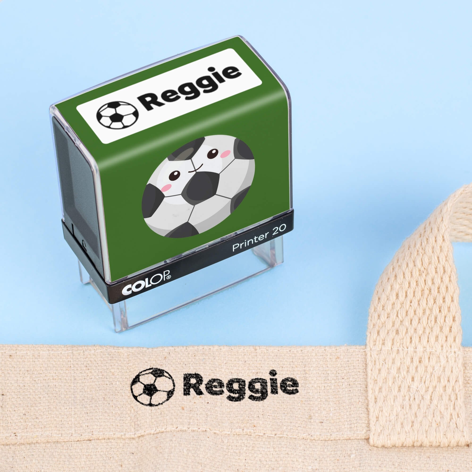 Soccer clothing name stamp beside a canvas tote bag labeled Reggie