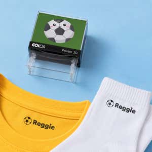 Soccer clothing name stamp with a yellow shirt and white socks labeled Reggie