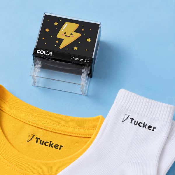 Thunder bolt clothing name stamp with a yellow shirt and white socks labeled Tucker