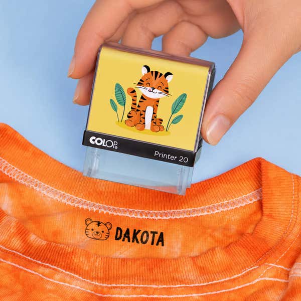 Tiger clothing name stamp above an orange shirt collar labeled Dakota