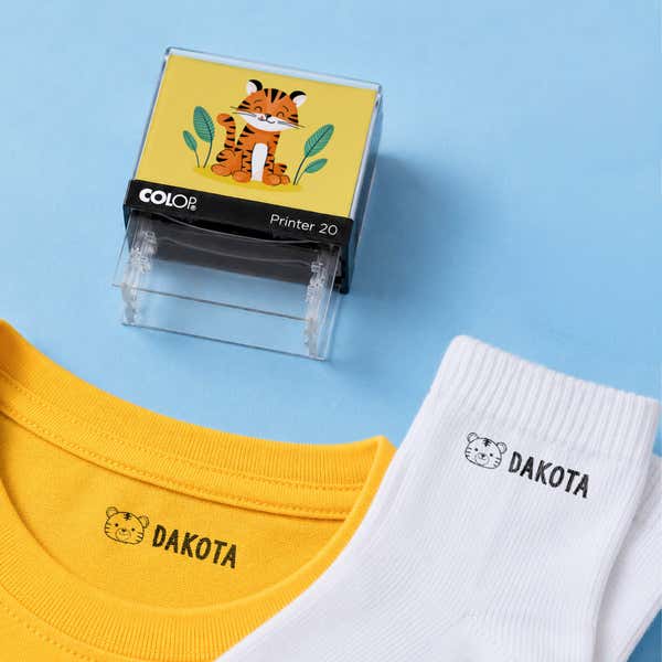 Tiger clothing name stamp with a yellow shirt and white socks labeled Dakota