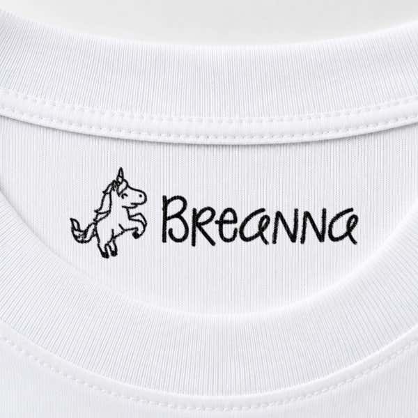 Unicorn name stamp impression reading Breanna inside the collar of a white shirt