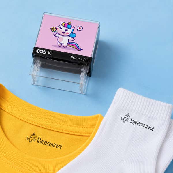 Unicorn clothing name stamp with a yellow shirt and white socks labeled Breanna