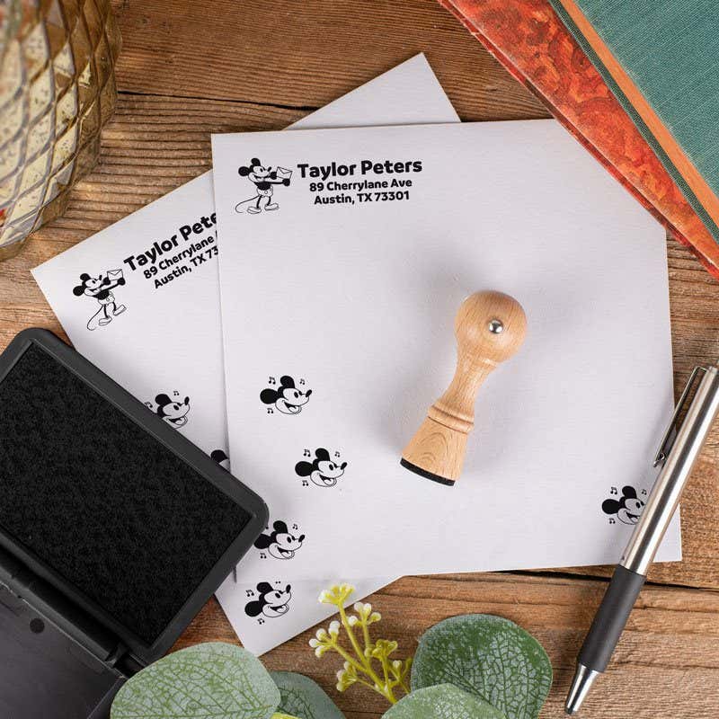 Overhead shot of Steamboat Willie Envelope Accent Craft Stamp Stamped on Envelope Next to Black Ink Pad