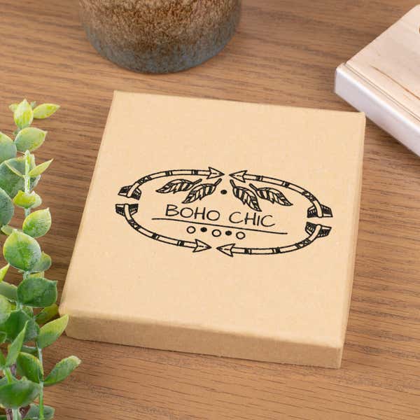 Business logo stamped on box with a custom wood stamp