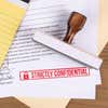 1/2" x 4" wood handle confidential stamp on business document