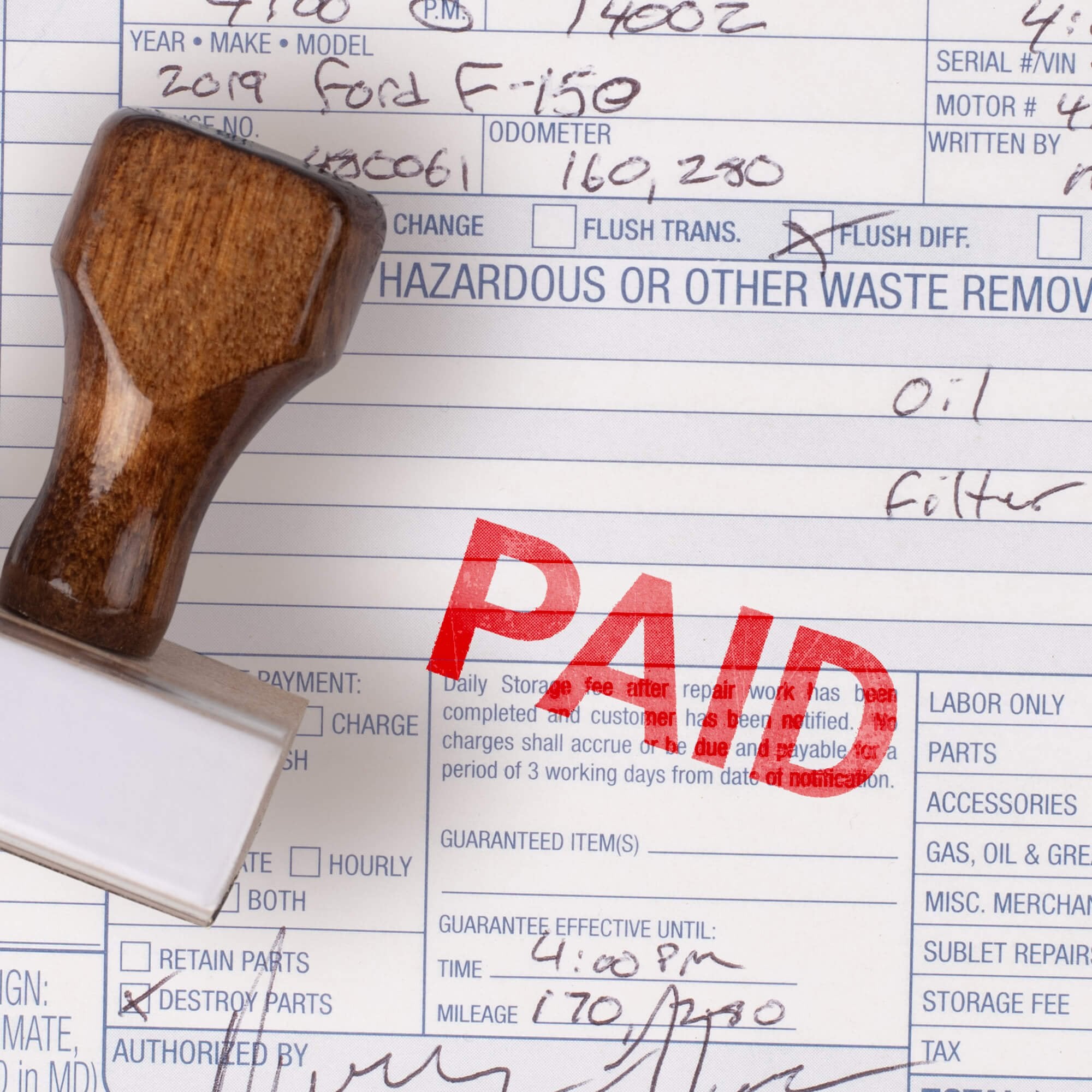 Personalized wood stamp with the impression paid on a document Personalized wood stamp with the impression paid on a document