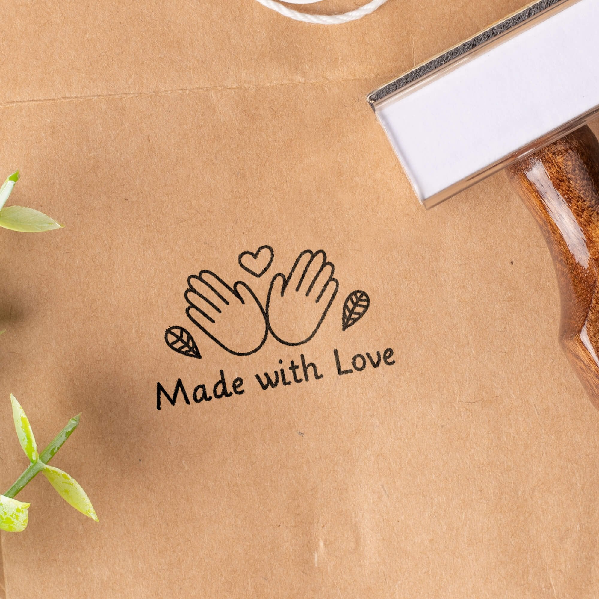 Custom wood handle stamp with a logo impression on packaging. Custom wood handle stamp with a logo impression on packaging.