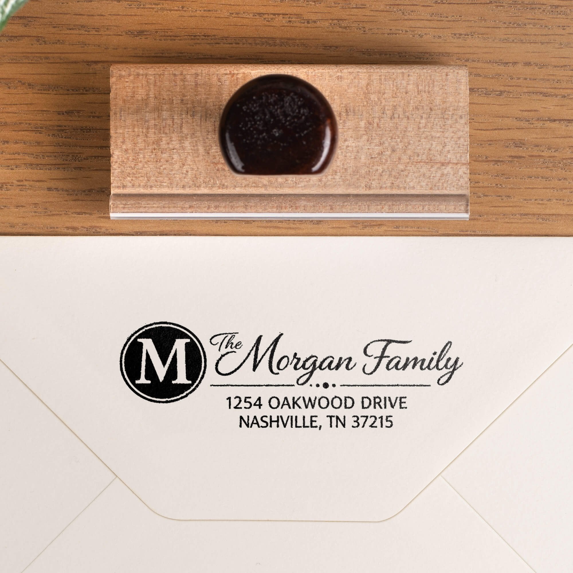 Custom wood address stamp on envelope with monogram return address impression