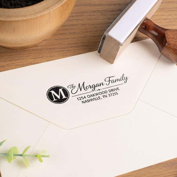 Wooden rubber address stamp creating custom return address on envelope flap